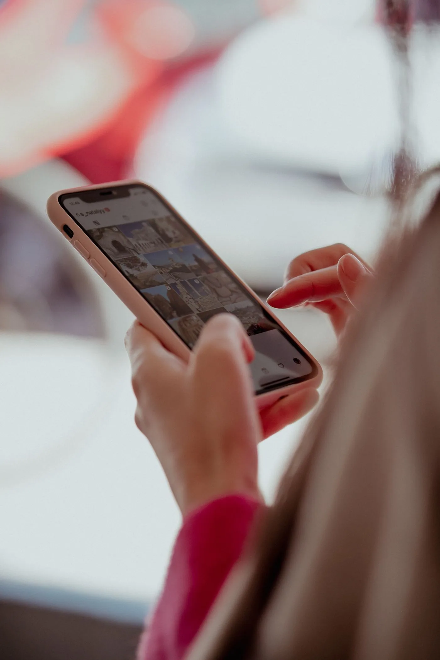 Hands browsing a smartphone